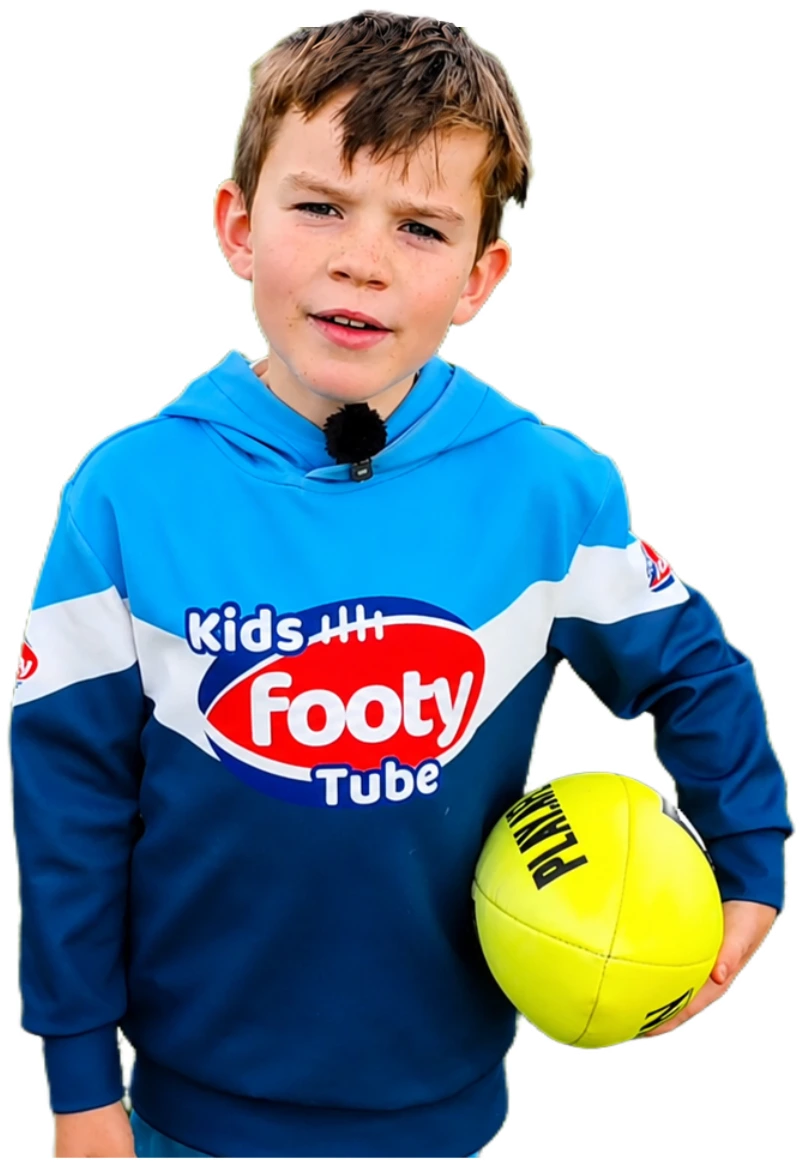 Harry holding a yellow football